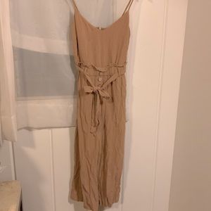 Tan Privately Privileged jumpsuit with high waist and belt.